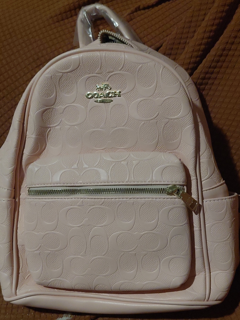 Coach Pale Pink Embossed Signature Mini Backpack